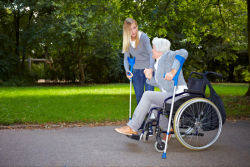 lady assisting patient to walk
